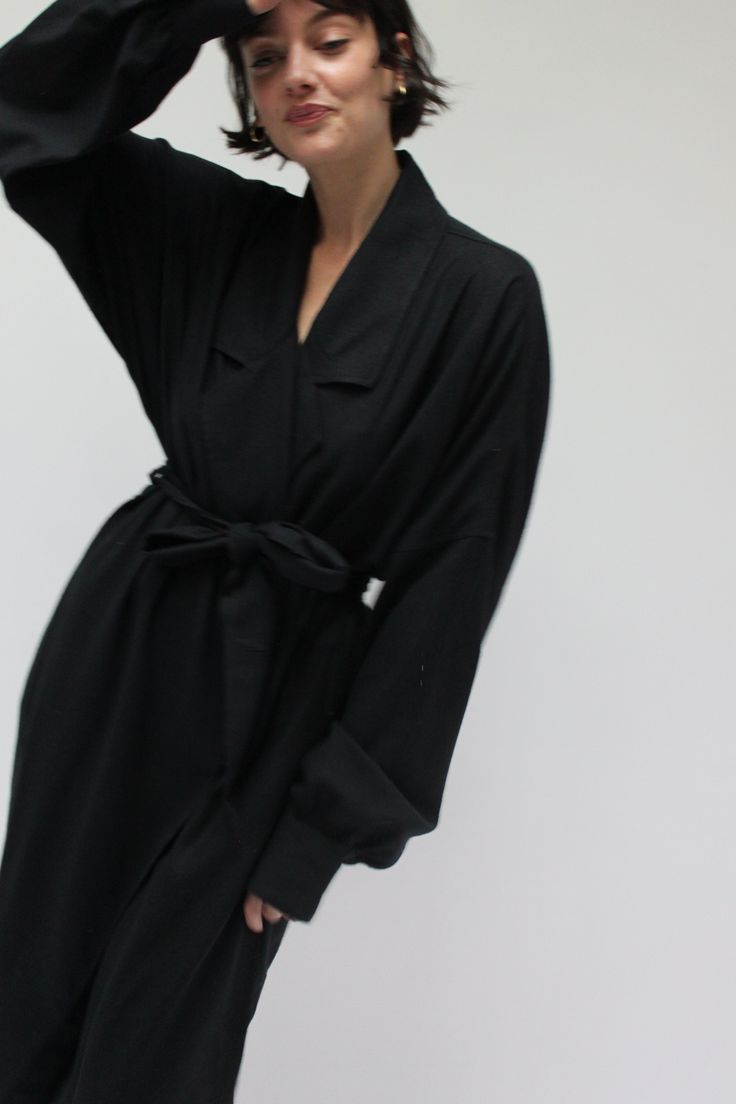 The Layla Wrap dress is a beautiful and versatile piece. Featuring a dropped balloon sleeve, open front, dramatic blazer cut collar, side pockets, and matching belt. Wrap and belt at the waist, pair with gold accessories and heeled sandals. This can also be worn as a coat unbelted over a favorite tee, trousers, or denim. Made in USA Luxury Belted Fall Dresses, Belted Office Dress For Fall, Formal Belted Dress With Tie Waist For Fall, Formal Fall Belted Dress With Belted Cuffs, Fall Formal Belted Dress With Tie Waist, Spring Evening Belted Dress, Chic Belted Dress For Evening In Fall, Elegant Belted Dress With Belted Cuffs For Fall, Chic Fall Belted Dress With Belted Cuffs