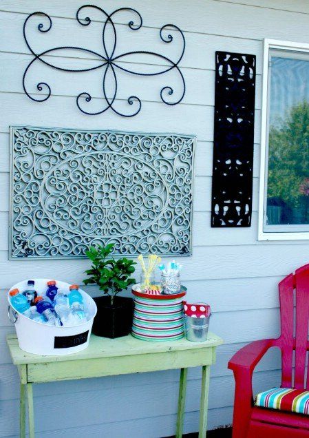 a red chair sitting next to a green table