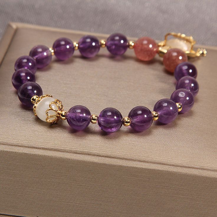 Be grateful for all the good things in life and truly enjoy every moment. Use this "Crown • Amethyst Jade Bracelet" to remind yourself how lucky you are, and never forget to acknowledge and appreciate the simplicity and beauty of everyday life. Natural amethyst, jade, strawberry crystal Bead diameter: 8 mm Premium zinc alloy Elastic - Suitable for hand circumference: 14-18 CM Hypoallergenic, lead & nickel free *We carefully select each gemstone to offer gems with the best quality. As gemstones are natural materials, stone colors may vary slightly from the images, making this beautiful bracelet completely unique, just like you!If you aren't in LOVE with your purchase, please let us know within 30 days of receiving your item, and you'll receive a stress-free refund. Amethyst Stone Bracelet, Strawberry Crystal, Good Things In Life, Enjoy Every Moment, Jewelry Accessories Ideas, Lucky You, Accessories Ideas, Jade Bracelet, Be Grateful