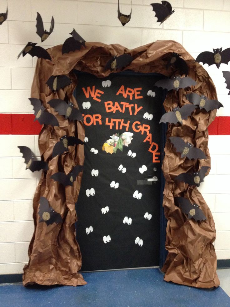 a door decorated with bats and writing on the front is made out of brown paper that says, we are baby or 5th grade