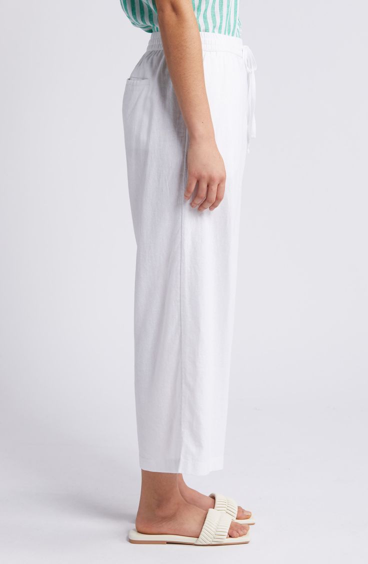 These lightweight linen pants are cut with cropped wide legs and topped with a comfortable elastic-drawstring waist. 25" inseam; 25" leg opening; 11" front rise; 15 1/2" back rise (size Medium) Elastic/drawstring waist Front slant pockets; back patch pockets 100% linen Machine wash, tumble dry Imported White Wide Leg Pants With Straight Hem For Summer, Comfortable White Linen Bottoms, Linen Relaxed Fit Sweatpants For Loungewear, Linen Wide Leg Bottoms With Drawstring, Relaxed Fit Cropped Leg Bottoms For Beach, Linen Sweatpants With Elastic Waistband For Loungewear, Wide Leg Linen Bottoms With Drawstring, White Linen Wide Leg Pants With Straight Hem, Linen Bottoms With Tie Waist And Straight Leg