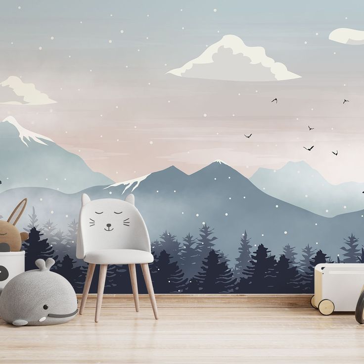 an animal themed nursery room with mountains in the background