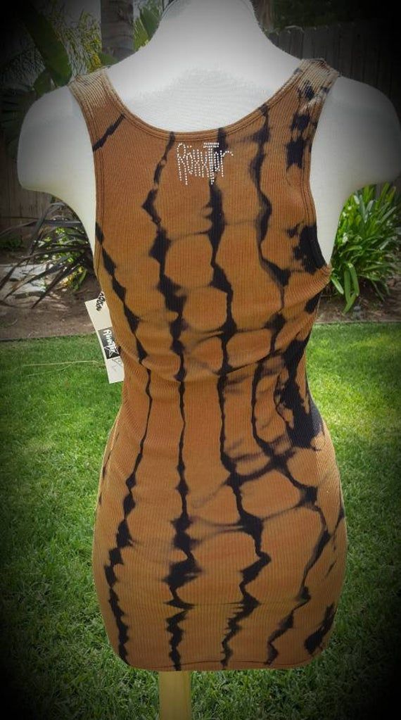 "Amazing reverse tie dye tank top! This tank is a One of a Kind! Pre-washed 100% cotton, Hand dyed Vintage Military Green Beret patch in Skull shape head with Black and brass studs around the skull. Black/brown reverse tie dye, long length, wife beater style. Clear Swarovski crystal \"Roxxtar\"logo in the back. Size Medium Large, it stretches. Thanks, Enjoy! #tiedye #gothic #hippie #gift #boho #rocker #goth #punk #unisex #biker #rockabilly #folk #tribe #dope #sick #style" Gothic Hippie, Boho Rocker, Skull Shape, Wife Beaters, Skull Patch, Reverse Tie Dye, Green Beret, Cute Scarfs, Special Ops