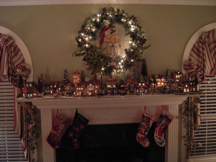 a mantle with stockings and christmas decorations on it