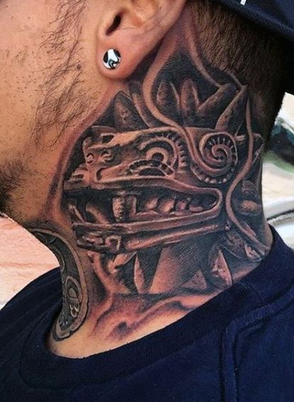 a man with a tattoo on his neck