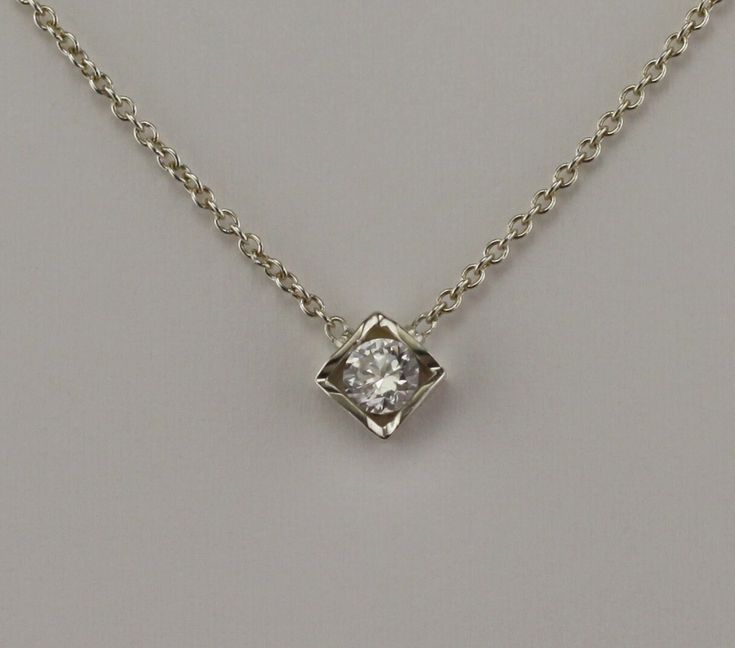 "18 kt white gold pendant. Set with 0.15 carat F-VS2 diamond. The Diamond can be upgraded in size or quality or lesser size and quality. The pendant comes with an 18 kt 1.1 mm 16\" cable chain.                The Diamond is certified. Als available in yellow gold or Platinum." Gold Pendant Set, Sterling Silver Rings Set, White Gold Pendant, Vs2 Diamond, Silver Ring Set, Personalized Pendant, Pendant With Chain, Square Pendant, Domed Ring