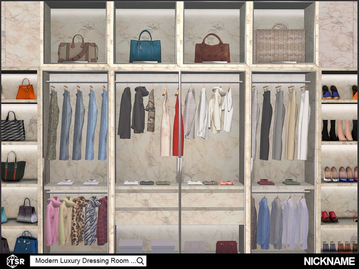 an open closet with clothes and handbags hanging on the wall, along with purses