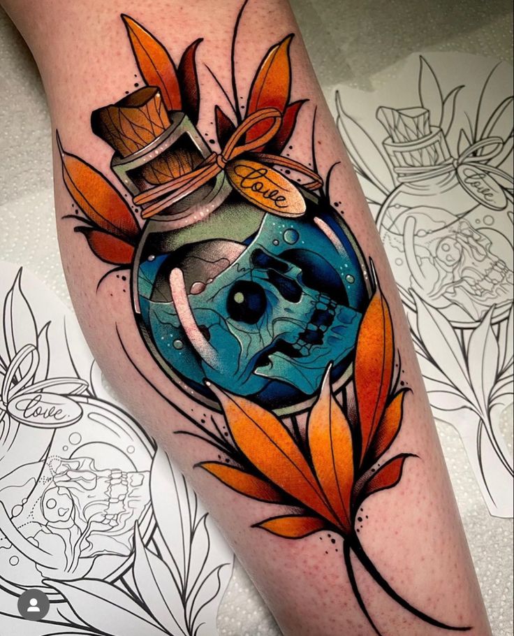 a tattoo with an image of a skull in a bottle and leaves on the leg