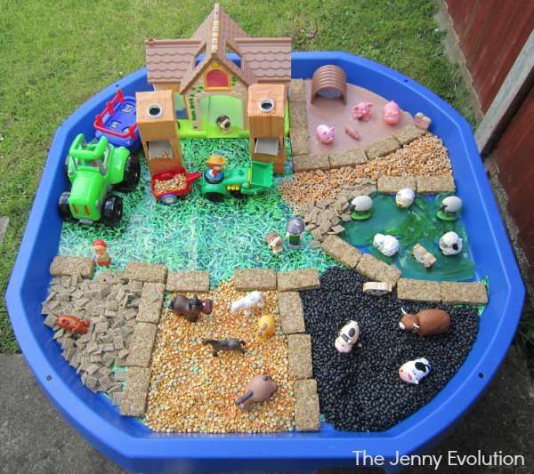 a play area with toys and gravel in it