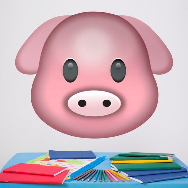 a pink pig head hanging from the side of a wall next to books and pencils