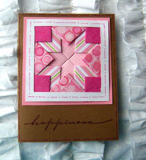 a card made with pink and white paper