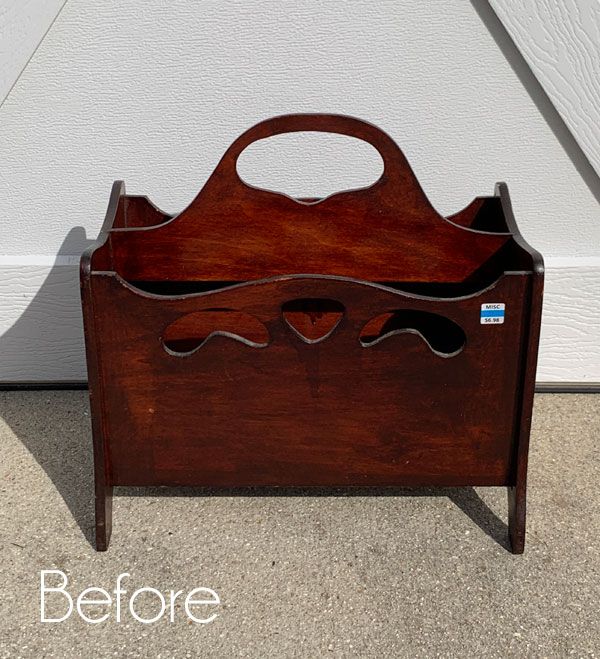 a wooden box with handles on the floor