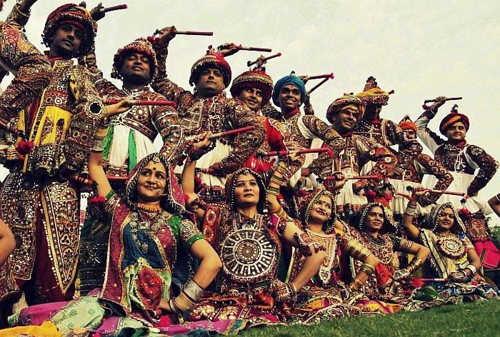 a group of people dressed in costume posing for a photo