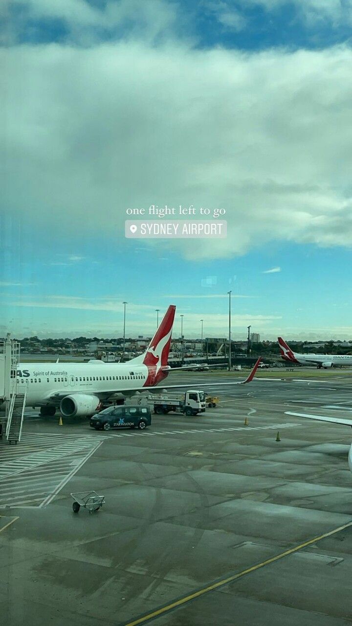 two airplanes parked on the tarmac at an airport