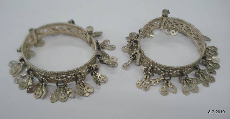 "Vintage Antique ethnic collectible very nice tribal old silver charm Bracelet or bangle pair from Rajasthan India. Worn by Banjara tribal people of Rajasthan. Beautiful workmanship all over the piece, adorn with silver charms. One quarter-hinged part can be open by pin. Original old pair in good condition with great antique look. great pair for jeweley collection. Inner diameter across - 5.3 cm(2\") Inner circumference -16.6 cm (6.5\") width include charms - 2.6 cm(1\") weight for pair - 92.5 g Nickel-free Traditional Bangle Jewelry, Festival Silver Beads Bangle Jewelry, Ornate Handmade Metal Bangle, Handmade Ornate Metal Bangle, Traditional Handmade Silver Bracelets, Traditional Handmade Silver Bracelet, Traditional Silver Metal Bangle, Traditional Metal Bangle For Festival, Traditional Metal Bracelets For Festivals