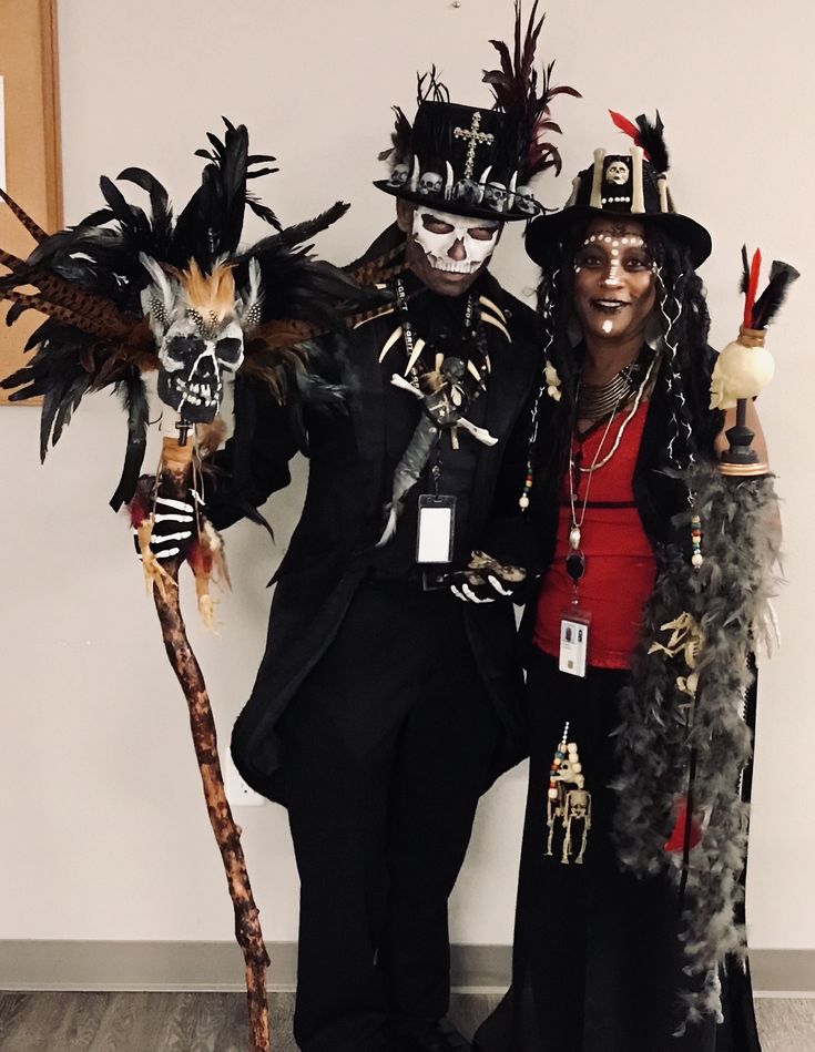 two people dressed up in costumes and masks