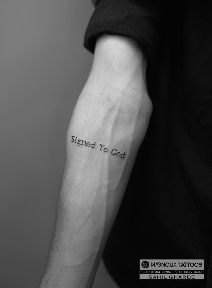 a person with a tattoo on their arm that says, signed to god