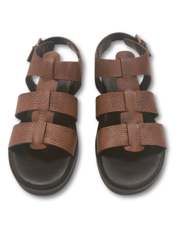 Step into style with the Vera combat platform sandal. This bold and trendy oobash sandal features a unique combat-inspired design, perfect for adding some edge to any outfit. With a comfortable footbed, these sandals will elevate your look while keeping you comfortable all day long. Features: Combat design Cushioned footbed Adjustable buckle Composition: Upper - 100% Leather Lining - 100% Leather Sock - 100% Leather Outsole - 100% Rubber Trendy Leather Wedge Sandals With Textured Sole, Casual Strapped Sandals With Buckle Closure, Casual Lace-up Platform Sandals, Brown T-strap Footbed Sandals For Summer, Casual Adjustable Platform Footbed Sandals, Adjustable Platform Footbed Sandals Casual, Summer Open Toe Footbed Sandals With Lug Sole, Cushioned T-strap Footbed Sandals For Vacation, Beach Leather Platform Lace-up Sandals