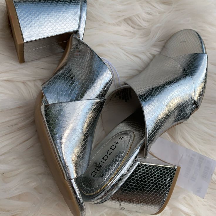 Nwt Silver Divided Mules/Sandals Excellent Condition Never Worn Casual Silver High Heel Sandals, Silver Open Toe Synthetic Mules, Silver Slip-on Heels For Summer, Casual Silver Heels For Beach, Silver Open Toe Casual Heels, Casual Silver Open Toe Heels, Casual Silver Mules For Summer, Silver Casual Heels For Spring, Casual Silver Heels For Spring