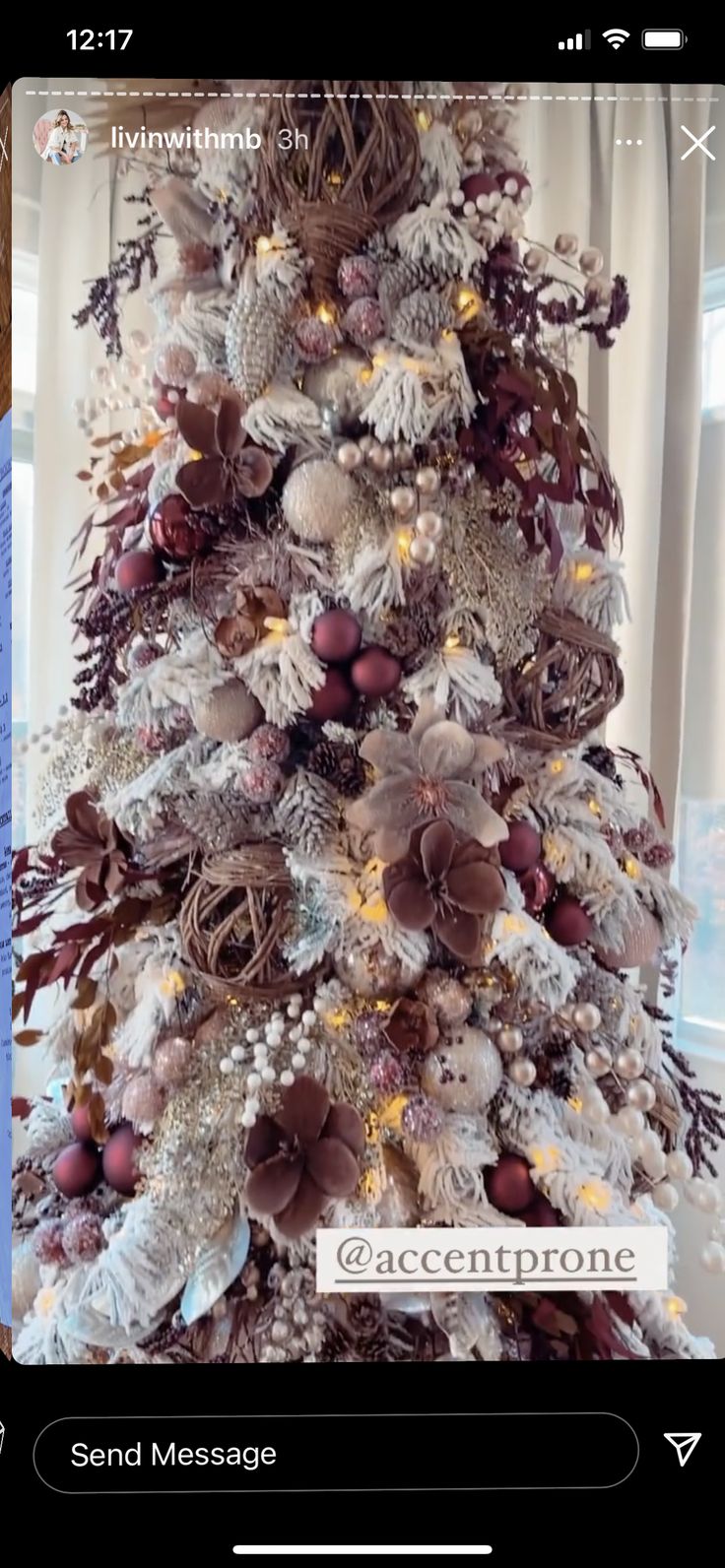 a white christmas tree with brown and silver decorations