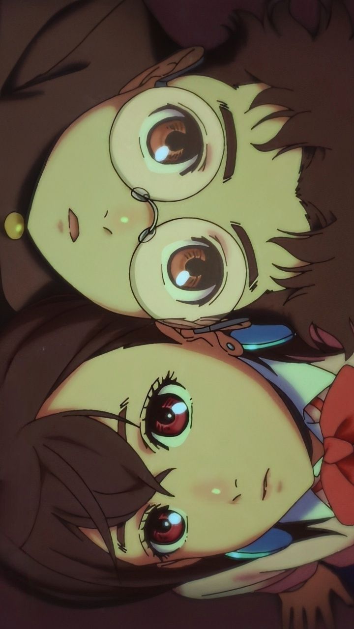 two anime characters with big eyes laying next to each other