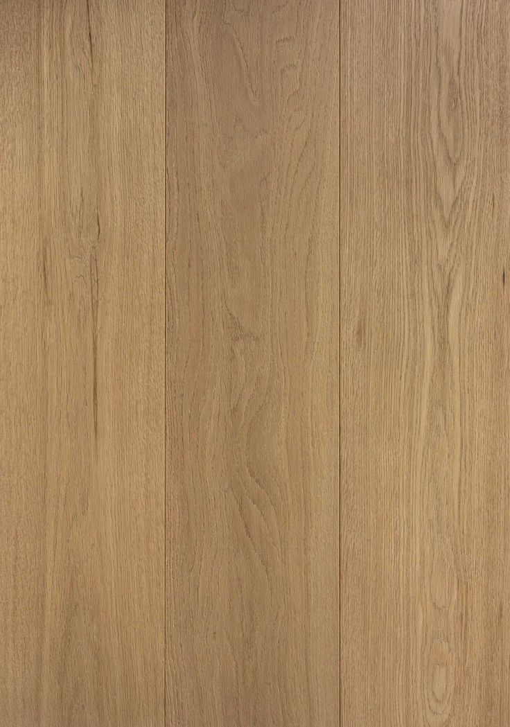 a close up view of the wood grains on this flooring project, with light brown tones