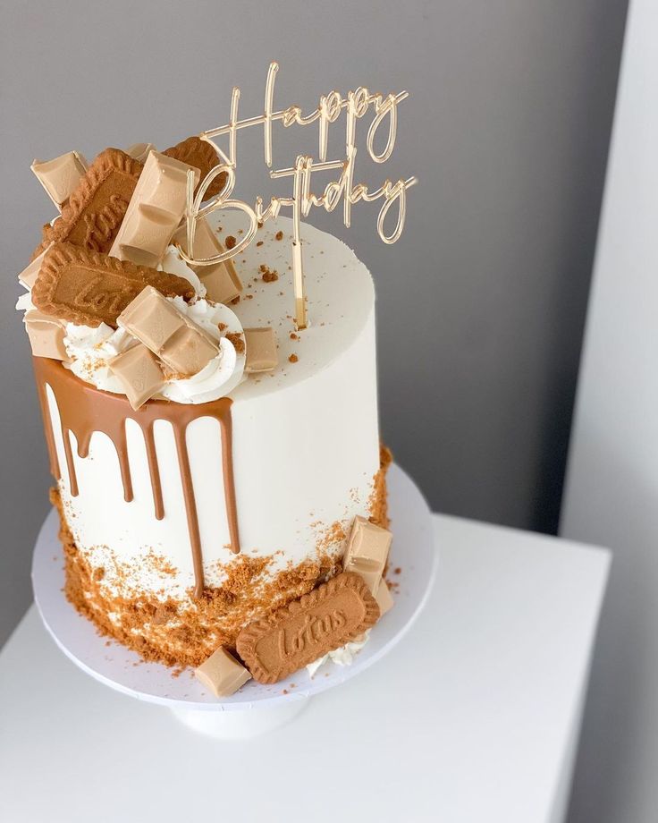 a birthday cake with chocolate and marshmallows on the top that says happy birthday