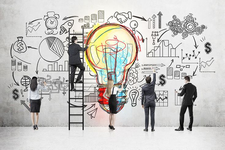 several people standing around a light bulb with drawings on it and one person holding a ladder