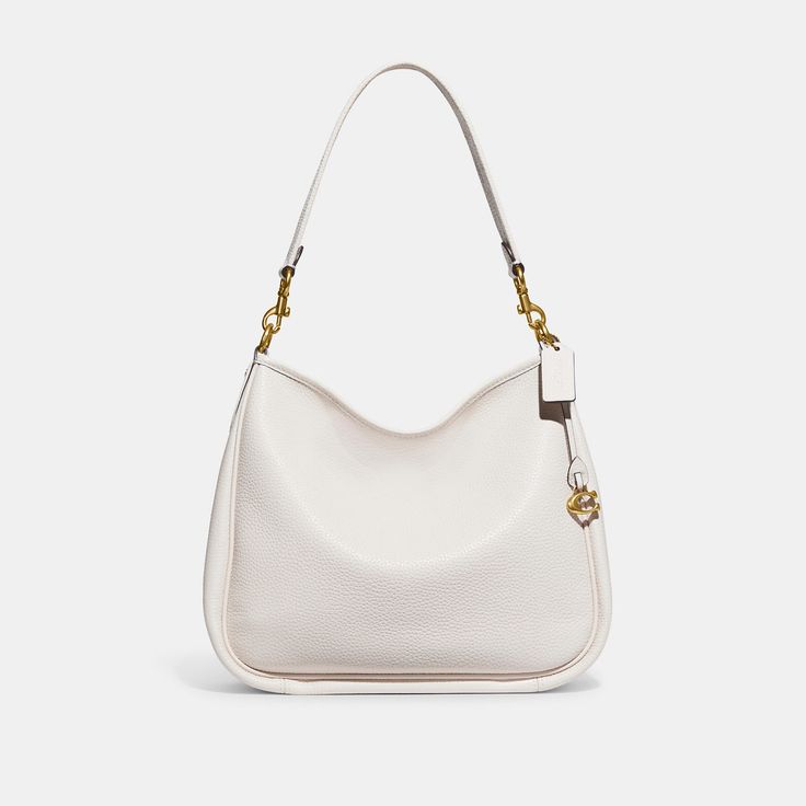 Deliberately slouchy with a sophisticated ease our Cary is a study in intentional laidback style. Crafted of buttery soft pebble leather with a silky sheen this surprisingly spacious bag has plenty of pockets to keep you organized. (Because even your most easygoing self should feel put-together.) | Coach Cary Shoulder Bag - Women's Purses - Brass/chalk Classic Hobo Bag With Smooth Grain And Double Handle, Coach Shoulder Bag With Smooth Grain For Everyday, Coach Hobo Bag In Textured Leather For Everyday Use, Coach Textured Leather Hobo Bag For Everyday, Coach Everyday Hobo Shoulder Bag, Modern Coach Hobo Bag For Everyday, Coach Textured Leather Everyday Shoulder Bag, Classic Coach Hobo Bag For Daily Use, Classic Textured Leather Hobo Shoulder Bag