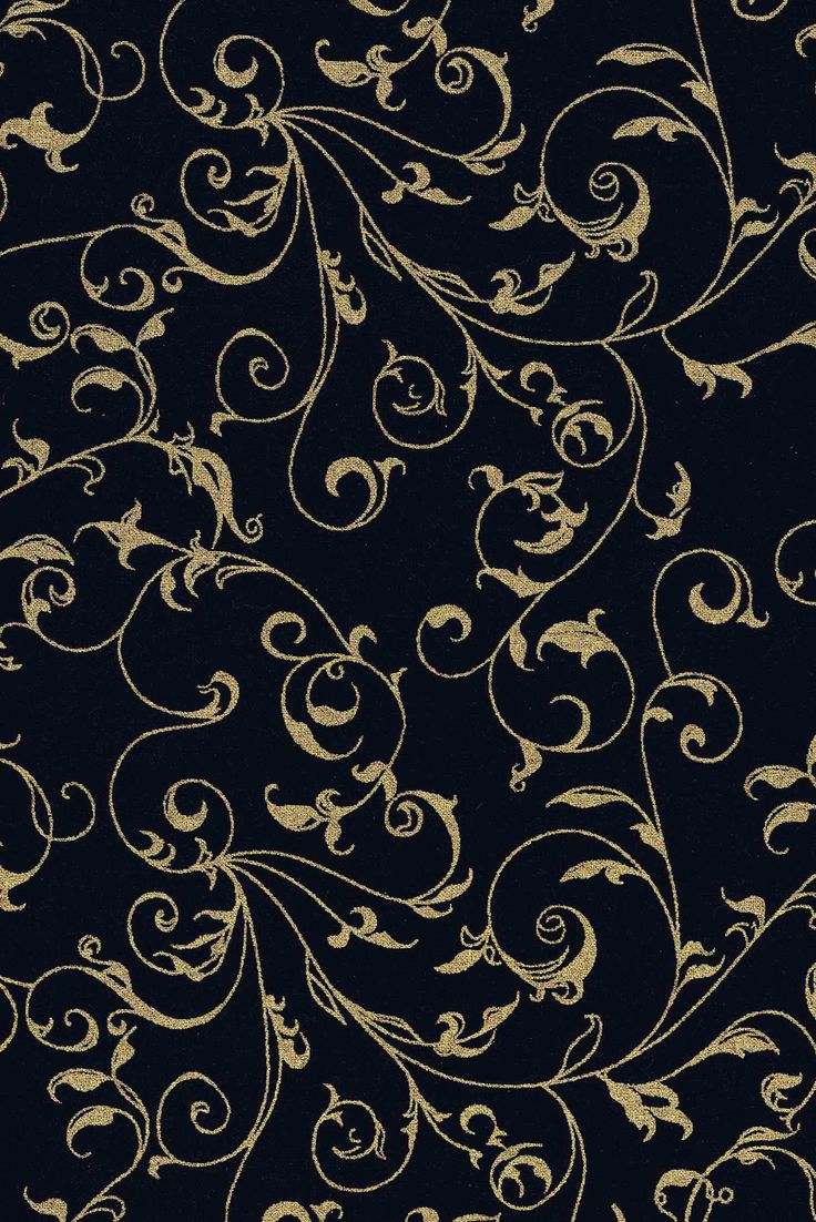 a black background with gold swirls on it