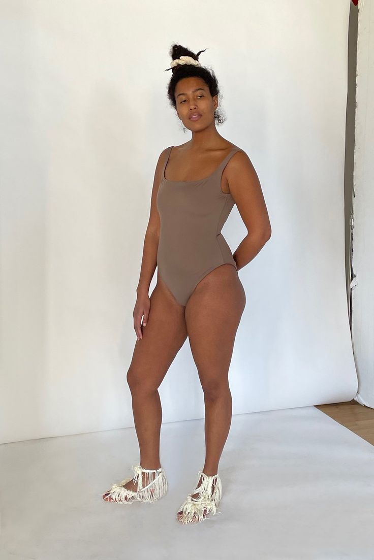 A tank style one piece, the Pistachio Suit boasts a comfortable and fun silhouette for a wide array of body types, with a high-cut leg, full bottom, our signature straight, yet curved neckline and modestly low rounded back. The Pistachio Suit is manufactured in New York City. split Fit notes – The Pistachio Suit fits true to size, we recommend to take your normal size in a one piece style. Please follow measurements below to understand sizing. All measurements are in inches before stretch. Recom Fitted Sleeveless Bodysuit For Everyday, Everyday Fitted Sleeveless Bodysuit, Summer Everyday Bodysuit With Scoop Neck, Summer Sleeveless Bodysuit, Summer Sleeveless Bodysuit For Everyday, Sleeveless Summer Bodysuit For Everyday, Everyday Solid Color Summer Swimwear, Remove Deodorant Stains, One Piece Style