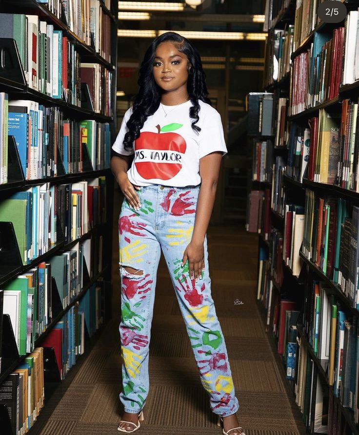 a woman standing in front of a library full of books