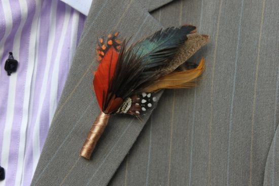 a man in a suit with a boutonniere on his lapel