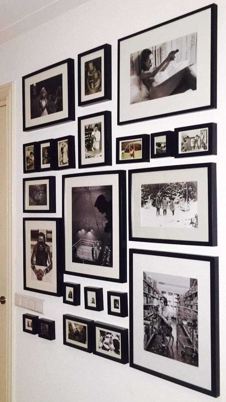 black and white pictures are hung on the wall