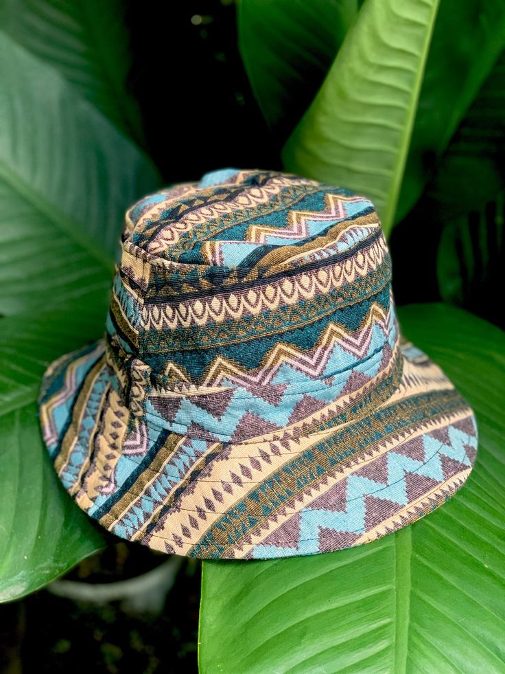 Artisan Bucket Hat | Boho-inspired bucket hat featuring a woven design with mixed patterns This Bucket Hat is made from 100% natural organic cotton ,        Hat is unisex fit great on both men and women Measurements  Large - inner circumference is 24" inches Brim 2" **These hats are handmade and so will vary slightly Blue Bucket Hat With Curved Brim For Festivals, Blue Bucket Hat With Short Brim For Festivals, Blue Short Brim Bucket Hat For Festivals, Blue Curved Brim Bucket Hat For Festival, Blue Wide Brim Bucket Hat For Festivals, Blue Brimmed Bucket Hat For Festival, Traditional Adjustable Hat For Outdoor, Adjustable Green Hats For Festivals, Adjustable Green Hat For Festivals