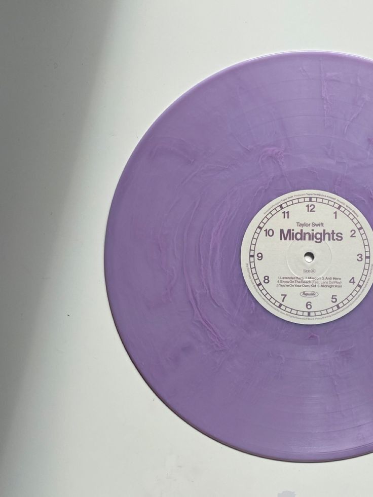 a purple record with the words midnights on it