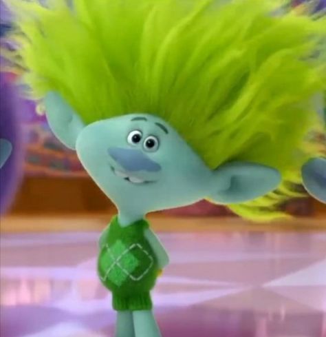 a cartoon character with yellow hair and green shirt