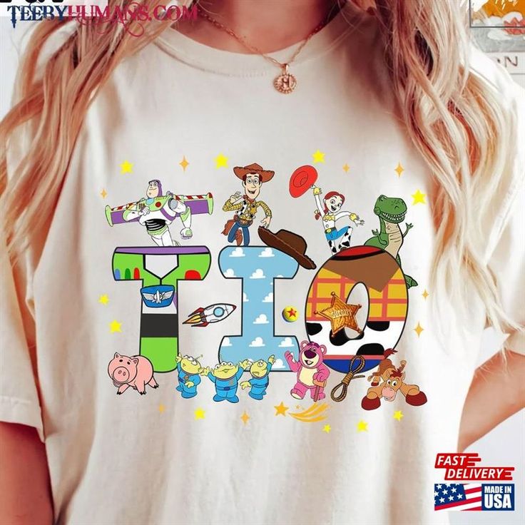 a woman wearing a white tshirt with cartoon characters on it