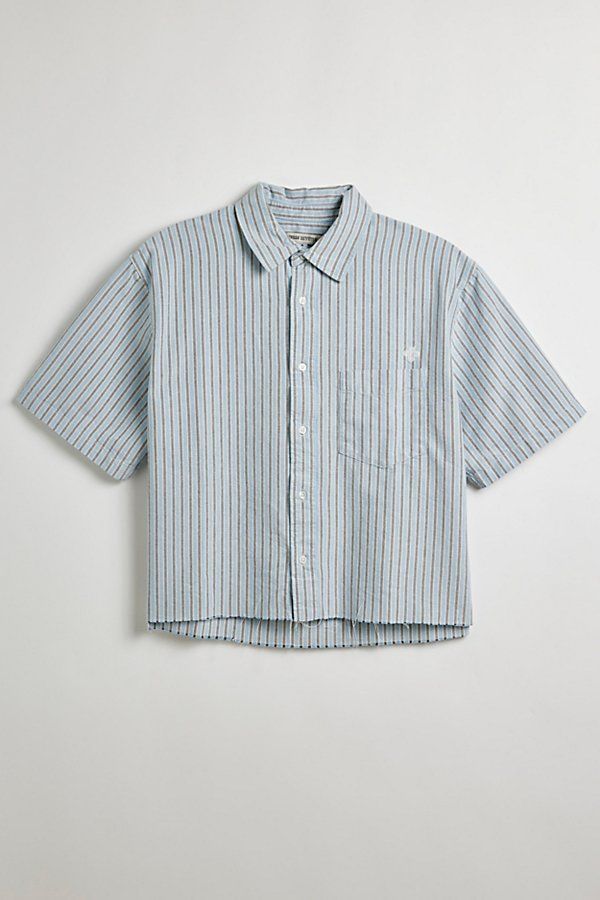 Updated stripe pattern Oxford shirt with a cropped hem. Short sleeve button-down shirt with a standard collar and left chest pocket. Features UO striped cut-off Oxford shirt Short sleeve shirt Standard collar Button-down front Chest pocket Boxy silhouette Cropped hem Content + Care 100% Cotton Machine wash Imported Size + Fit Model in Blue + Grey Stripe 6’2" and wearing size Medium Measurements taken from size Medium Chest: 24" Length: 23.5" | Urban Outfitters UO Striped Cut-Off Oxford Shirt Top Striped Button Up, Cropped Button Up, Cropped Shirt Men, Pastel Mens Fashion, Short Sleeve Button Up Men, Crop Top Men, Button Up Shirt Men, Striped Shirt Men, Mens Crop Top