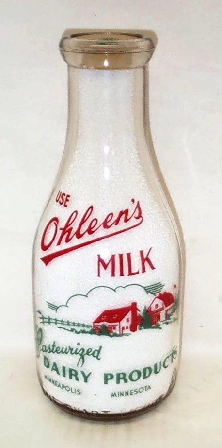 an old glass milk bottle with the word oleen's milk on it