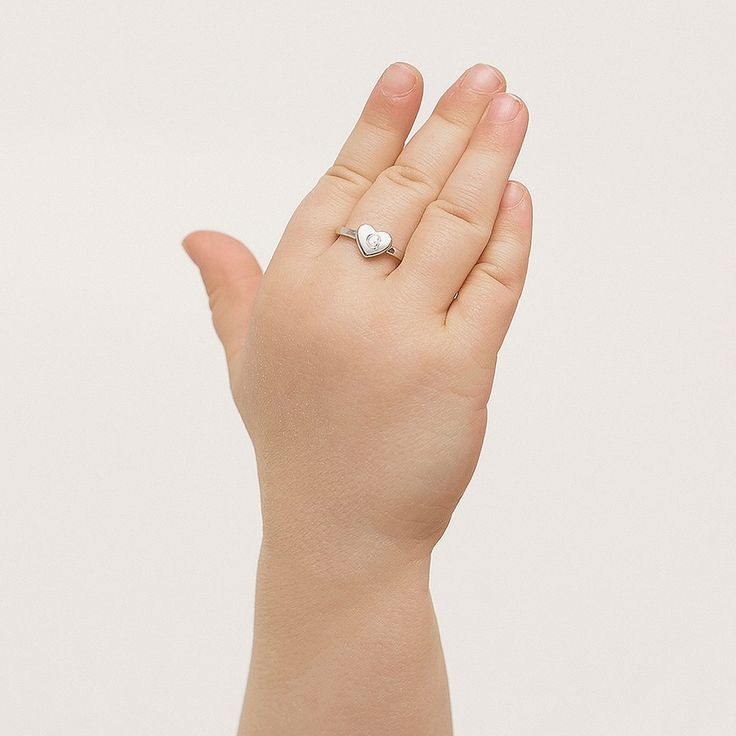 Your little girl will absolutely adore this delicately designed polished heart shaped ring. Beautifully crafted in genuine 925 sterling silver which is naturally hypoallergenic and suitable for girls with sensitive skin. Buffed to a brilliant luster, this sentimental choice for your little girl is destined to be cherished and is available in sizes 2-5. A gift box is included, ready for gift giving. Kids Ring, Monogram Hearts, Heart Shaped Ring, Kids Rings, Hearts Girl, Heart Shaped Rings, Kids Necklace, Personalized Monogram, Toddler Kids