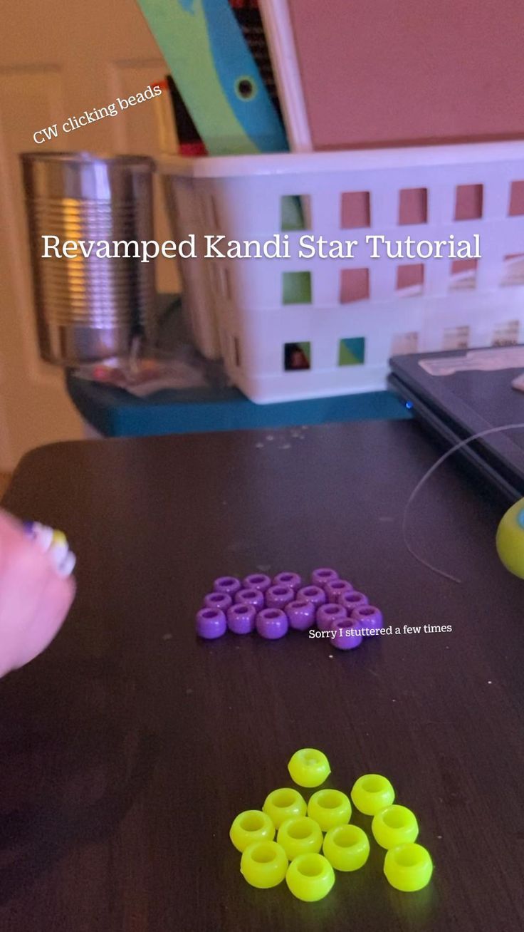 some yellow and purple beads are on a table