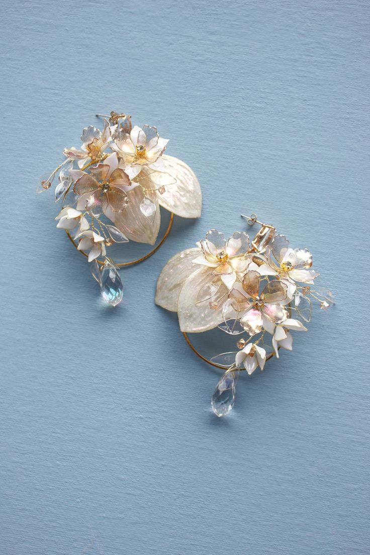 "Large Statement Flower Hoop Earrings Dangle hoop earrings Beautiful wedding earrings in shades of white, gold, pink, ivory and champagne made of uv resin and gold plated wire. Studs of earrings are made of silver. Every piece in a single copy.  This item is ready to ship. ♥ Love it and want to buy later? Click on the heart to your right that says \"Favorite.\" ♥ Want it now? Click the green \"Add to cart\" button. ♥ Want it now fast? Check our UPS delivery terms. https://www.etsy.com/listing/720565399/flower-fairy-express-delivery-with-ups-3 ♥ View more earrings; https://www.etsy.com/shop/FairyFlowerJewelry?section_id=28072613 ♥ Questions about how to buy? http://www.etsy.com/help_guide_checkout.php ♥ Special request, customer order, or you just have a question for me? https://www.etsy.co Gold Hoop Flower Earrings For Party, Gold Flower Cluster Earrings For Wedding, Delicate Gold Hoop Flower Earrings, Flower-shaped Single Hoop Earring For Weddings, Gold Flower Hoop Earrings For Wedding, Gold Floral Hoop Earrings For Wedding, Elegant Hoop Clip-on Earrings For Wedding, Elegant Rose Gold Hoop Flower Earrings, Elegant Rose Gold Flower Hoop Earrings