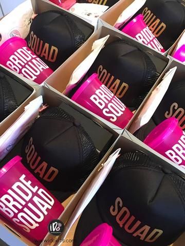 several boxes with hats in them sitting on top of each other and one has the word squad printed on it