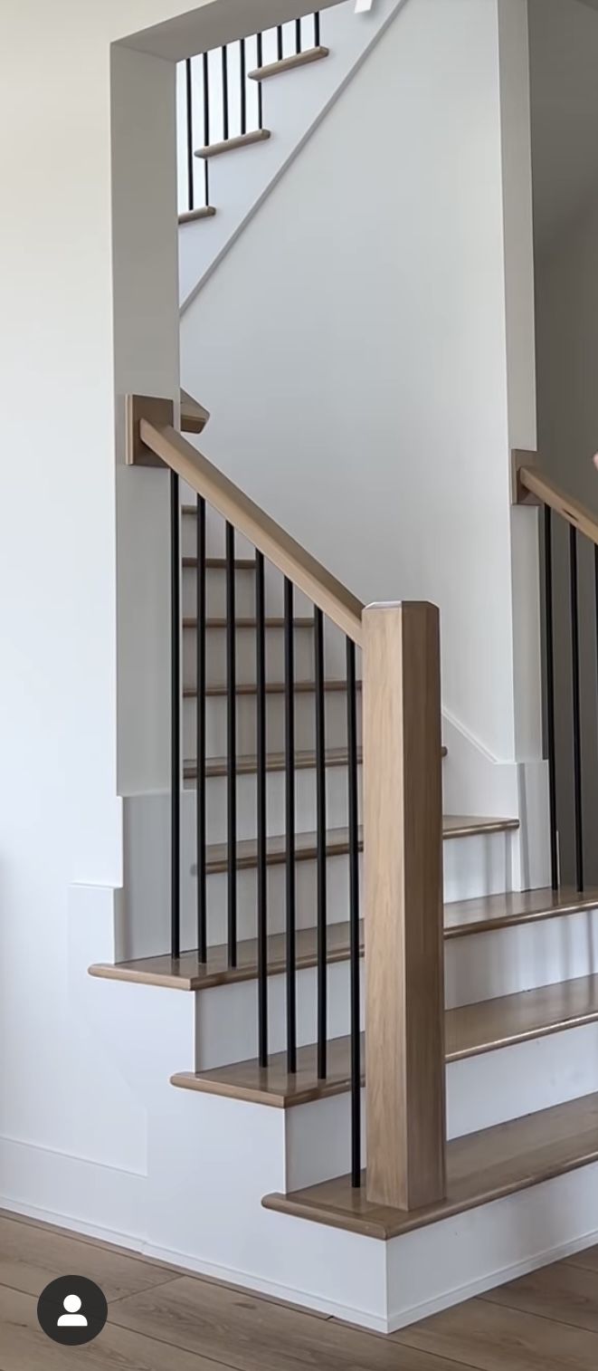 an empty room with some stairs and railings on the wall next to a door