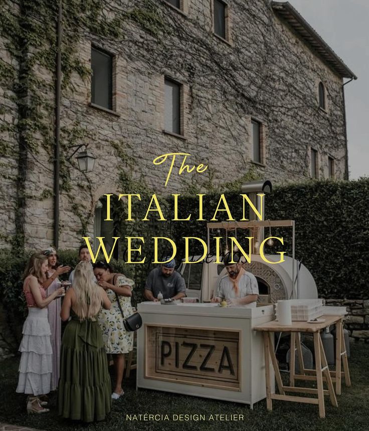 the italian wedding book cover with people standing around and eating pizza on an outdoor table in front of a stone building