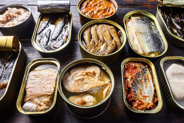 several tins filled with different types of food