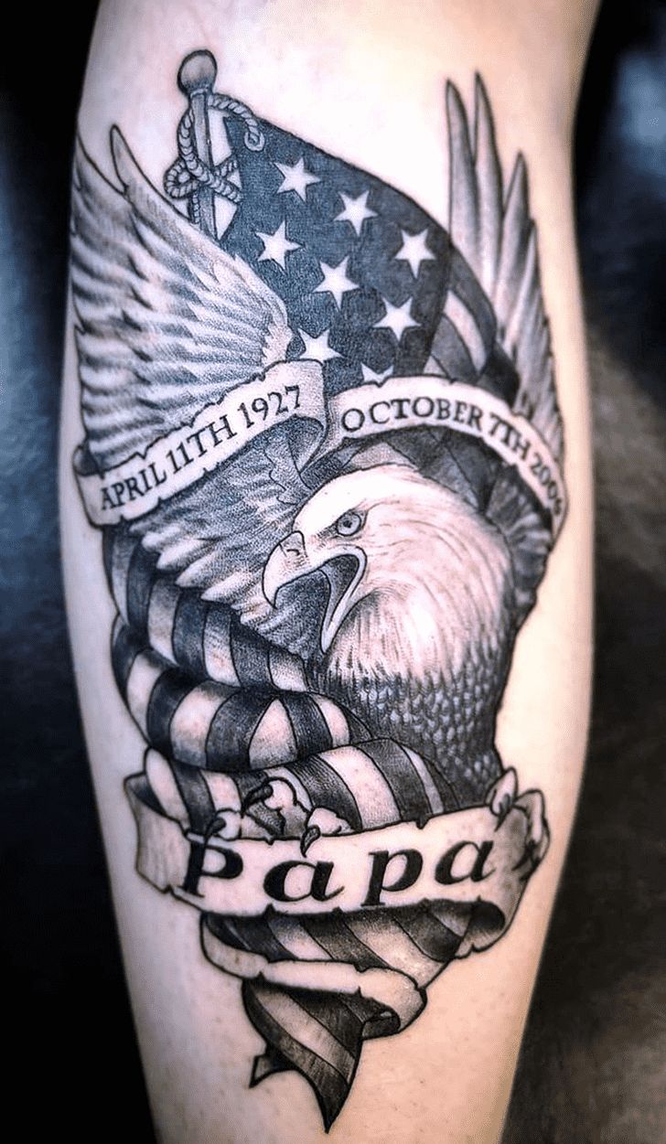 an american flag and eagle tattoo on the leg, with words written in black ink