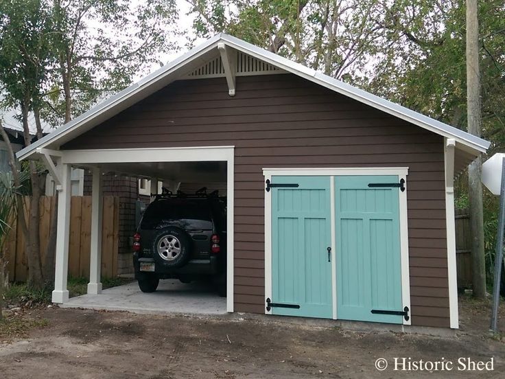 a car is parked in the garage with its door open