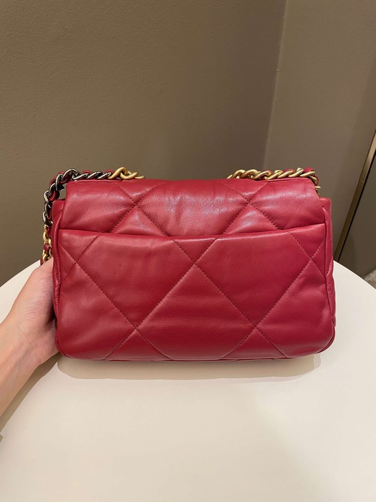 Chanel 19 Flap BagDark Red AGHWSmall 26 x 17 x 8 cmChain drop 46 cm28 Series9.5/10 Excellent (tiny dot mark at back area and minimal leather signs of use otherwise excellent)Includes box, dust bag and ity cardRTP 9160 sgd Price now 5200 sgd 3900 usd CN6020-01 Chanel 19 Flap Bag, Chanel 19, Red Chanel, Bag Dark, Gold Ounce, Chanel Black, Flap Bag, Chanel Bag, Dark Red